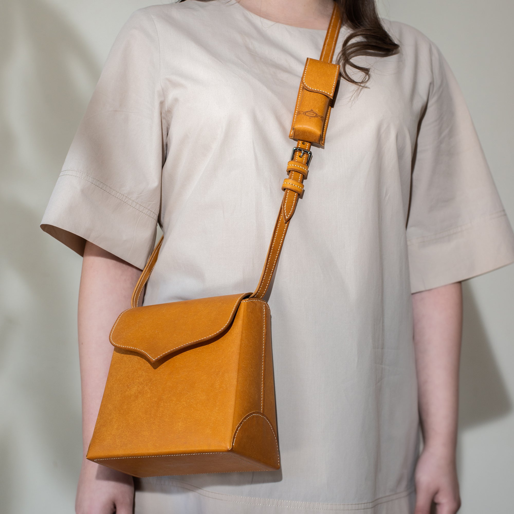 Miniature flap bag for leather strap